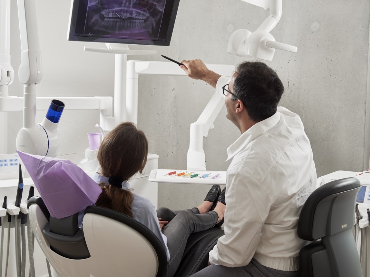 Dentist examining a patient's teeth during a check-up