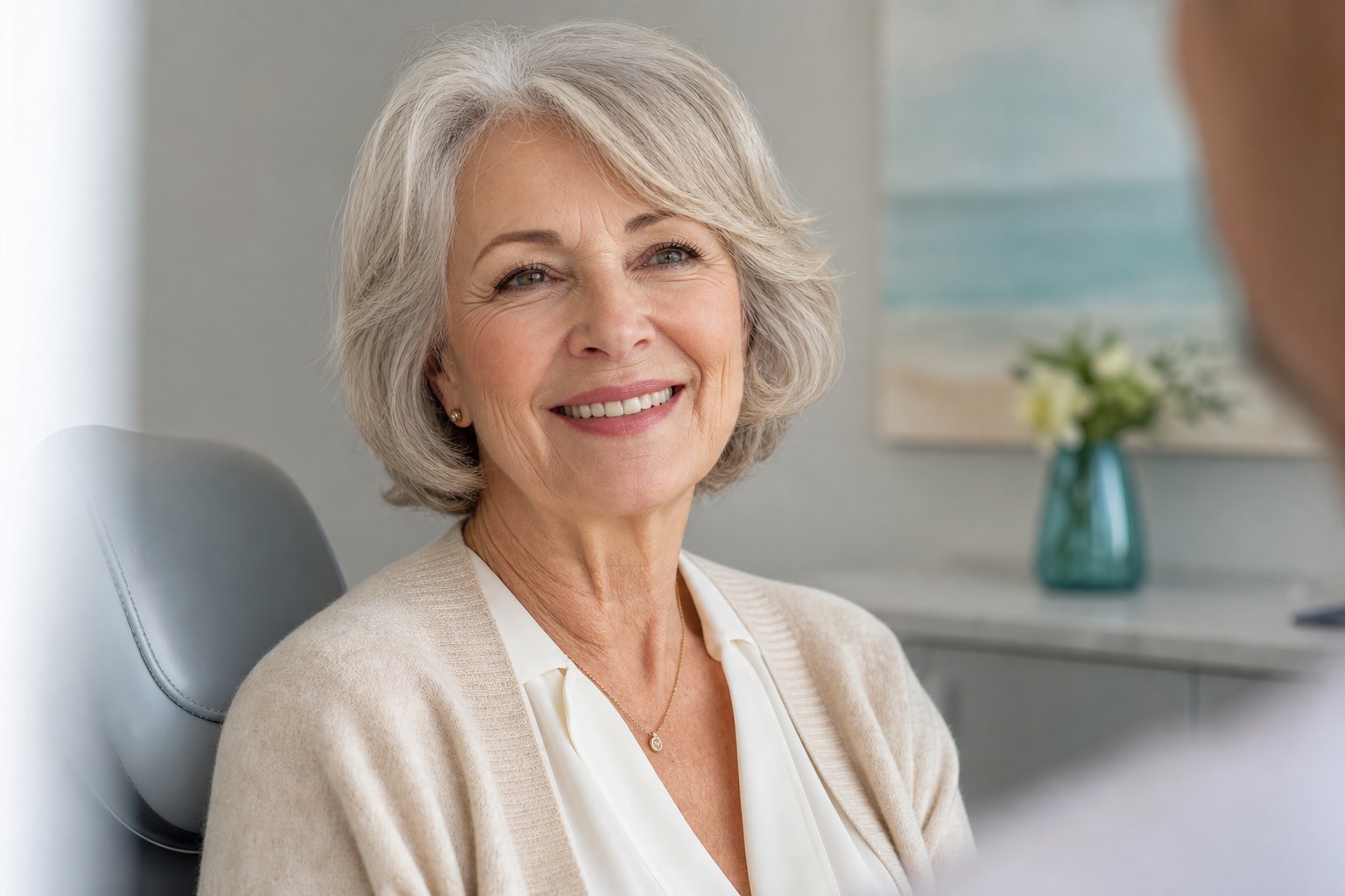 Patient smiling confidently after denture treatment